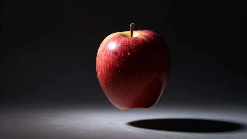 Manzana cayendo, iluminación dramática, realista